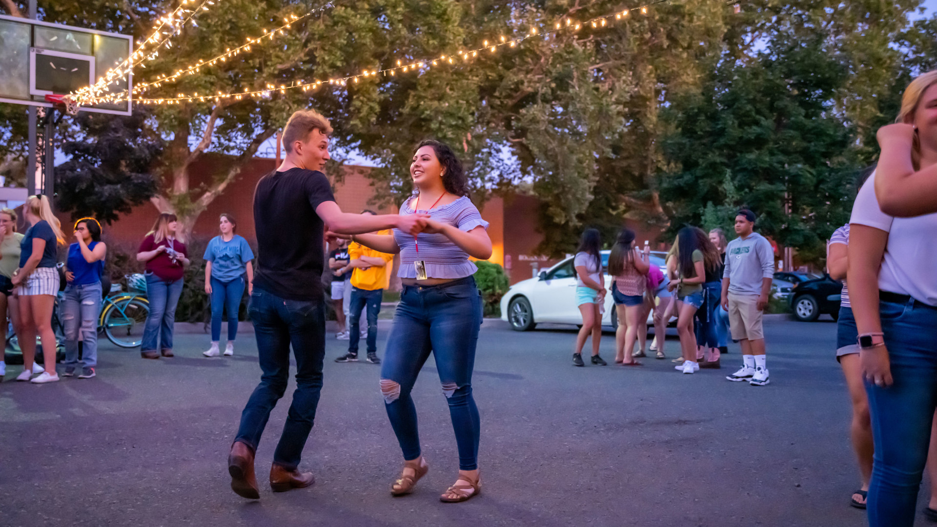Two students swing dancing outdoors